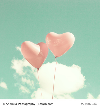 Two pink heart-shaped balloons